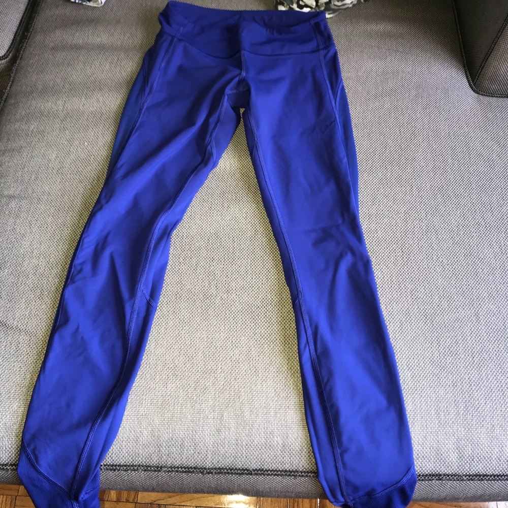worn, royal blue lululemon tights